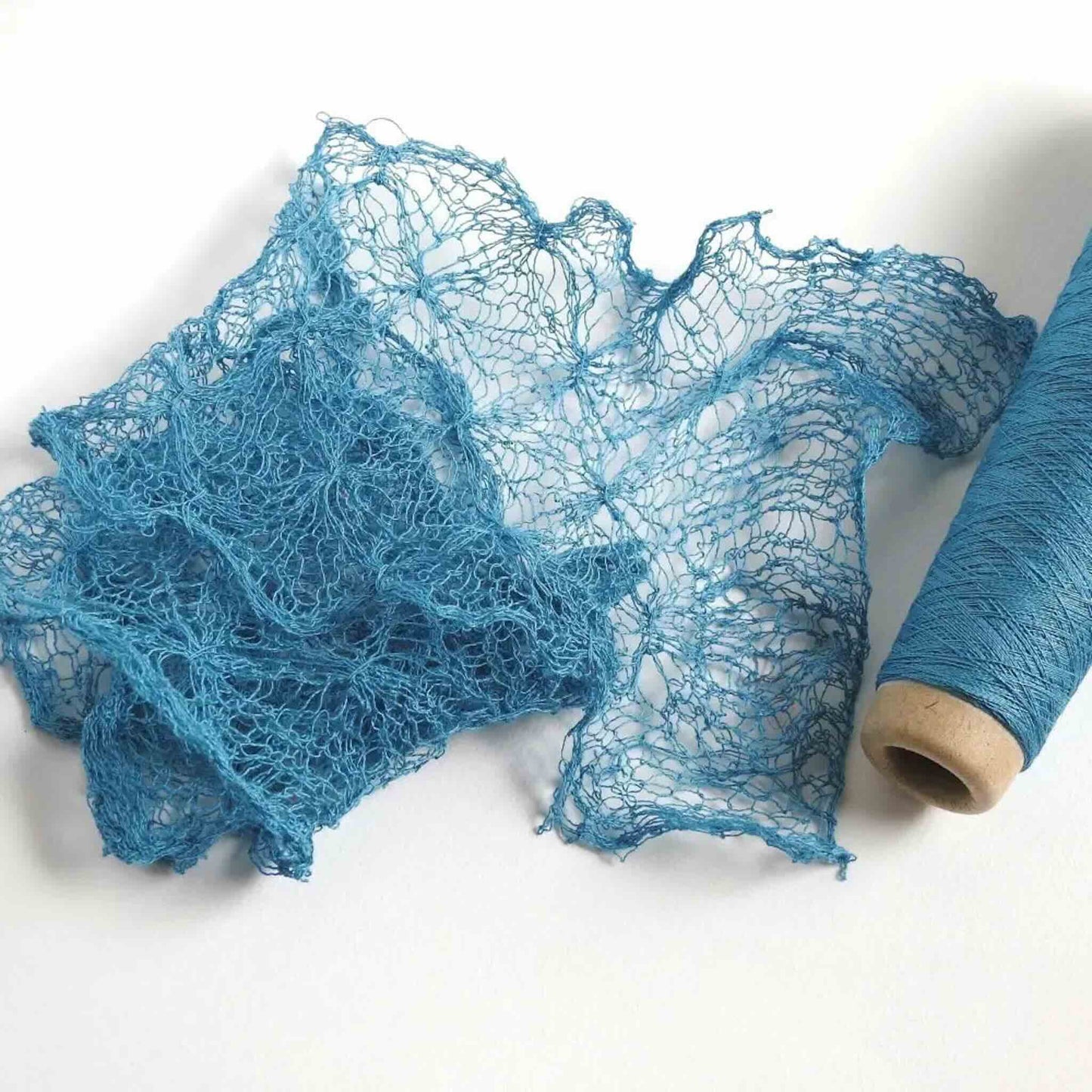 Knitted scarf in Sky colour Silk Stainless Steel Lace yarn.