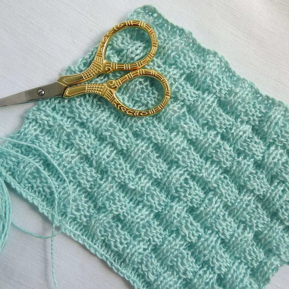 
                  
                    sample knitted square in basket weave stitch using linen yarn in polar wind. Linen yarn for knitting, weaving, crochet. Natural vegan yarn for summer, baby, socks.
                  
                