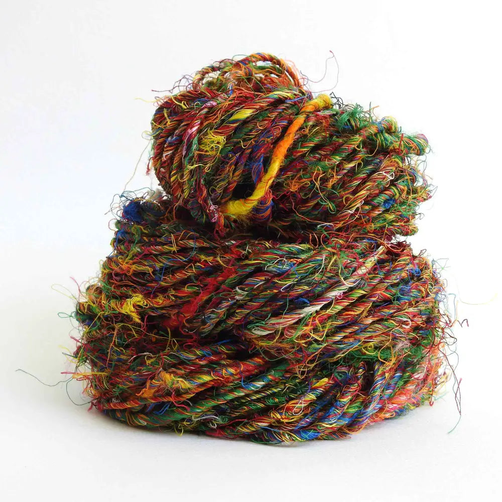 
                  
                    A ball of Banana Silk Yarn in Indian Jewel. Natural, vegan banana fiber yarn for weaving, punch needle, knitting, crochet. Soft, squishy, chunky yarn.
                  
                