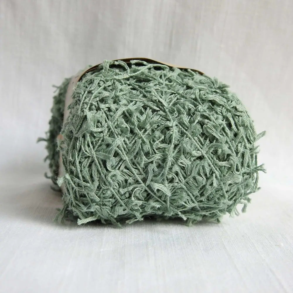 
                  
                    A Ball of Habu Textiles Cotton Cork Chenille Yarn in Ocean. Soft, fluffy, cotton yarn for baby, scarves, garments, toys. Knitting, crochet, weaving yarn. Natural cotton vegan yarn. Habu yarn A-25
                  
                