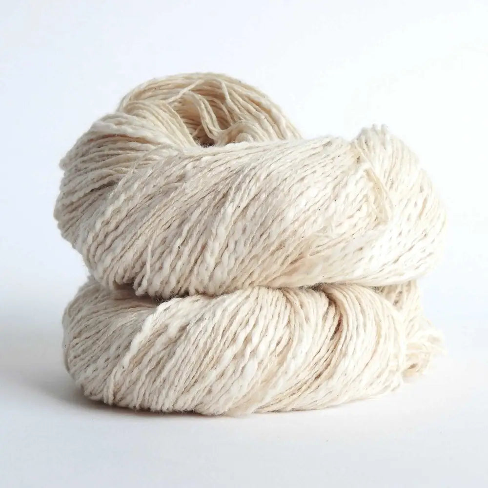 Skein of organic natural Cotton yarn. Cotton yarn is super soft with a slight slub for texture. Cotton knitting yarn Australia in off white. For knitting, weaving and crochet