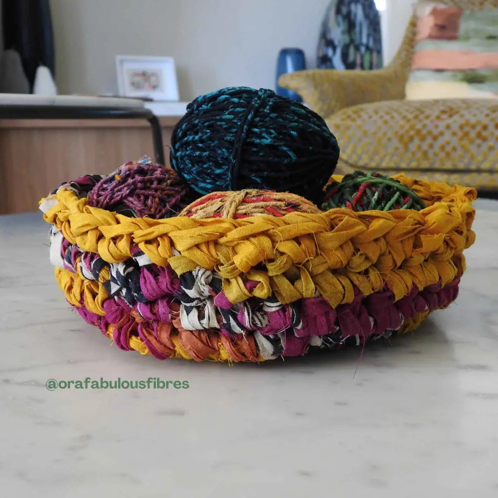 
                  
                    crochet basket using recycled sari cotton for weaving, baskets, trim, hair, hats, bags. Assorted colours and patterns. Crafted from upcycled sari cotton.
                  
                