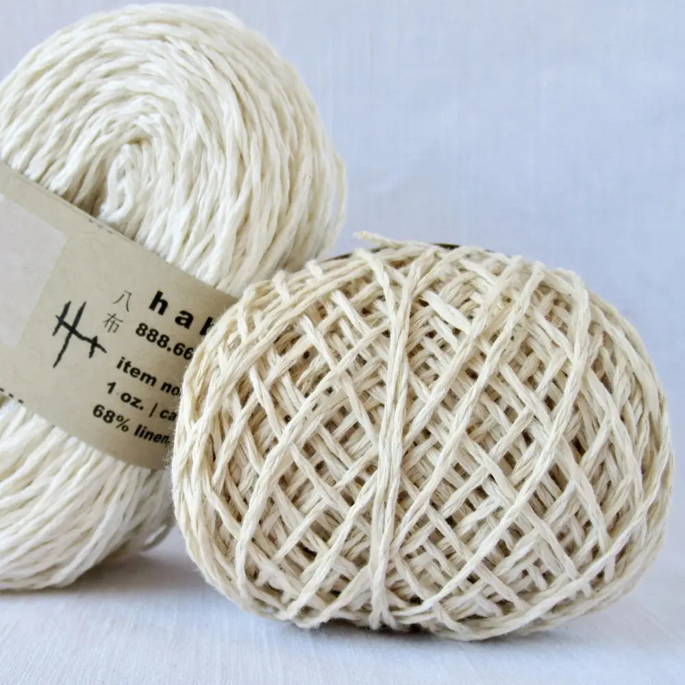 
                  
                    Balls of Habu Linen Cotton Paper Yarn  in White and Off White. Use for weaving, knitting and crochet. Create garments, hats, bags, baby clothes. Natural vegan yarn. Use for warp yarn when weaving. Habu yarn A-188
                  
                
