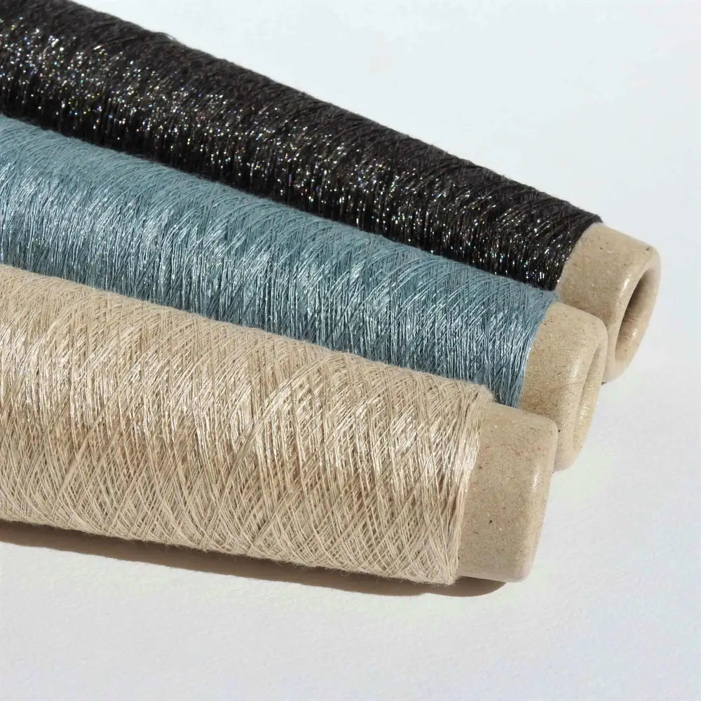 Cones of Habu Textiles Stainless Steel yarn  in Greige, Steel Grey and Black. Japanese yarn for weaving, knitting, textiles, jewellery, scarf. Lace weight yarn. Habu Textiles Linen Stainless Steel N-66