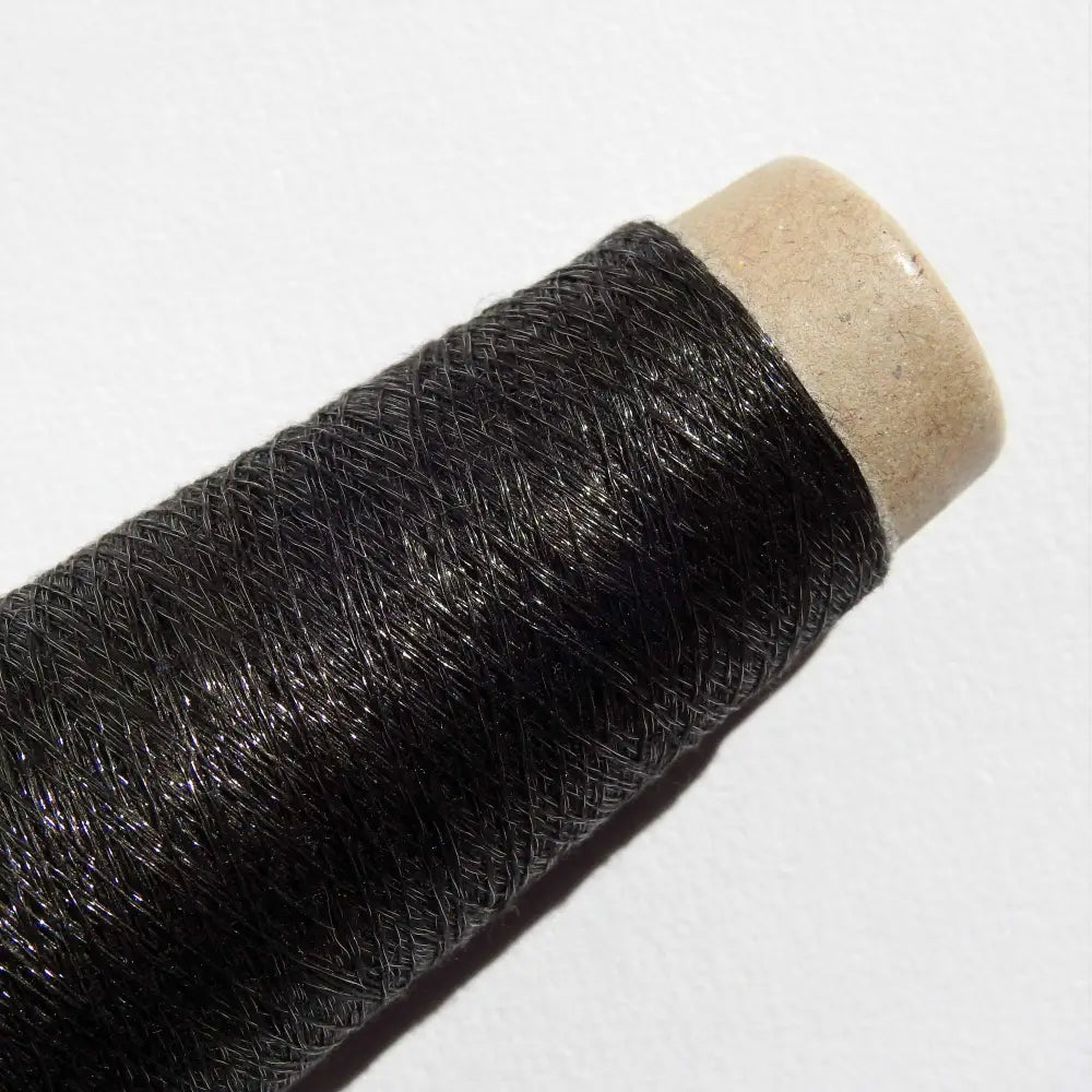 
                  
                    Cone of Habu Textiles Stainless Steel yarn  in Black. Japanese yarn for weaving, knitting, textiles, jewellery, scarf. Lace weight yarn. Habu Textiles Linen Stainless Steel N-66
                  
                