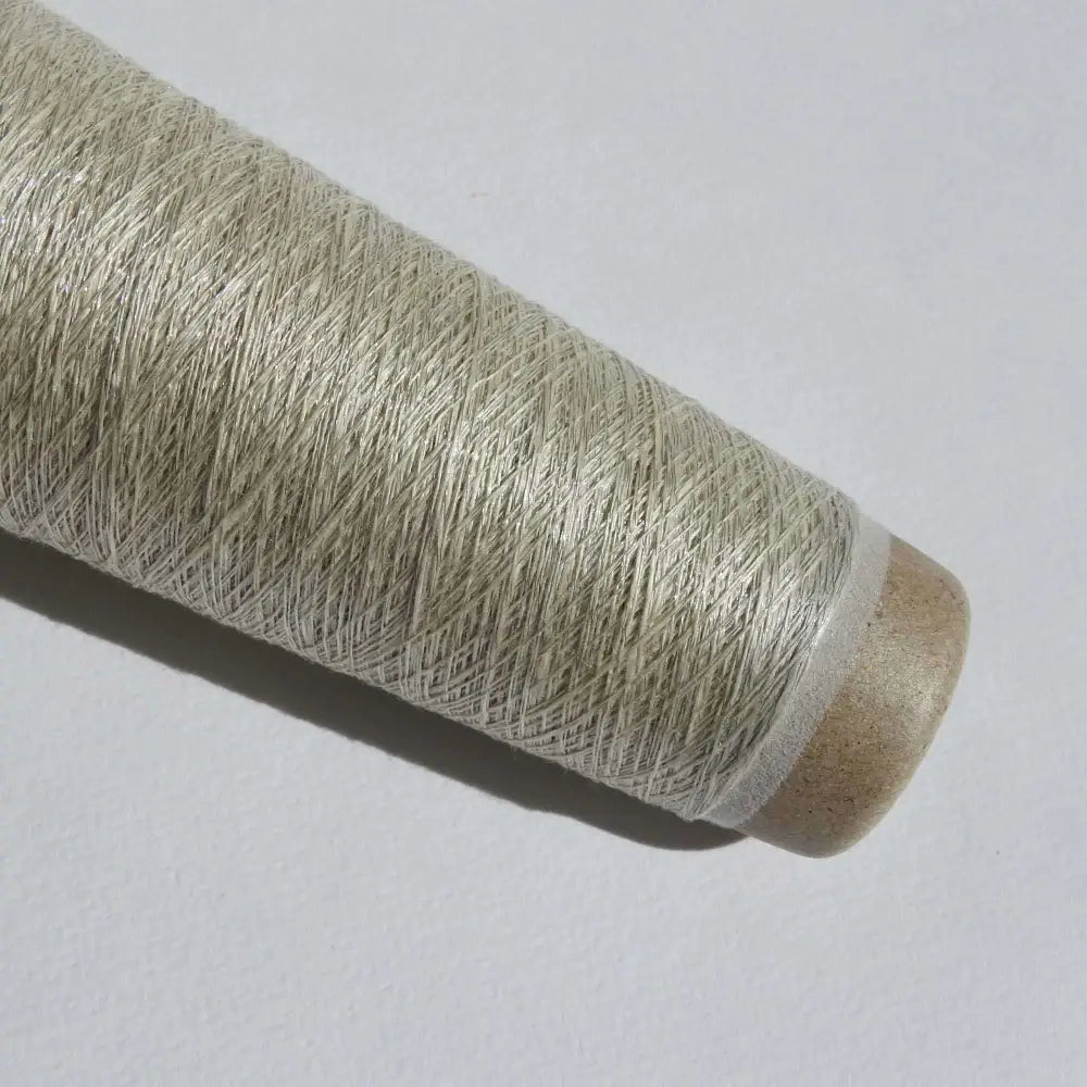 
                  
                    Cone of Habu Textiles Stainless Steel Linen  yarn  in White. Japanese yarn for weaving, knitting, textiles, jewellery, scarf. Lace weight yarn. Habu Textiles Linen Stainless Steel N-66
                  
                
