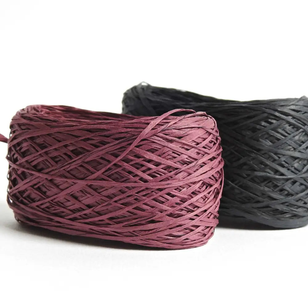 
                  
                    ball of habu textiles raw silk wrapped paper yarn in wine and charcoal. Japanese paper yarn for weaving, crochet, knitting. Habu Textiles Raw Silk Wrapped Paper Yarn N-24b
                  
                