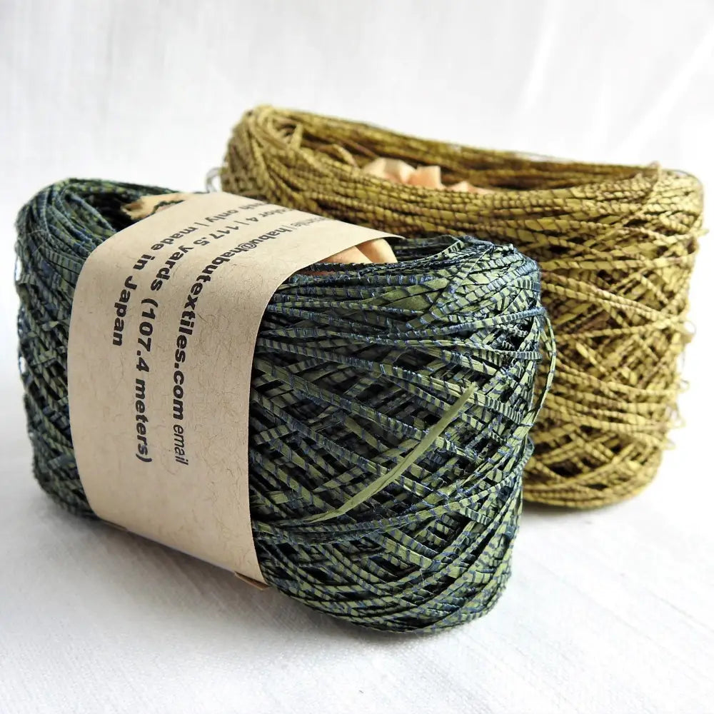 
                  
                    Balls of Habu Textiles paper yarn in green and mustard. Silk wrapped paper yarn for weaving, crochet, knitting. Create jewellery, clothiing. textile art. Habu linen paper yarn. Habu Textiles Silk Wrapped Paper Yarn N-94
                  
                