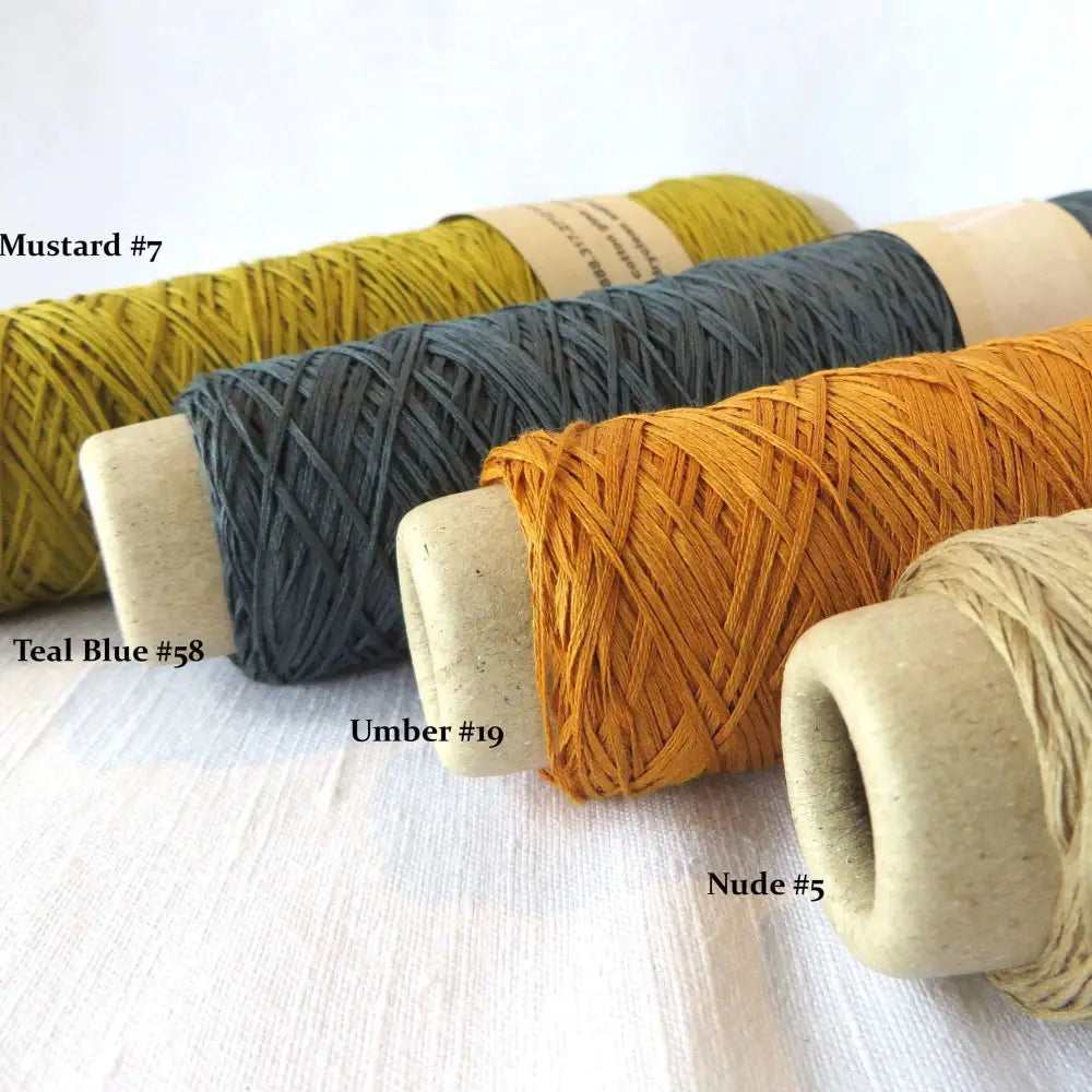 
                  
                    Habu Cotton Gima yarn in mustard, teal blue, umber and nude. Yarn for weaving, knitting, crochet. Habu Cotton Gima. Habu yarn A174
                  
                