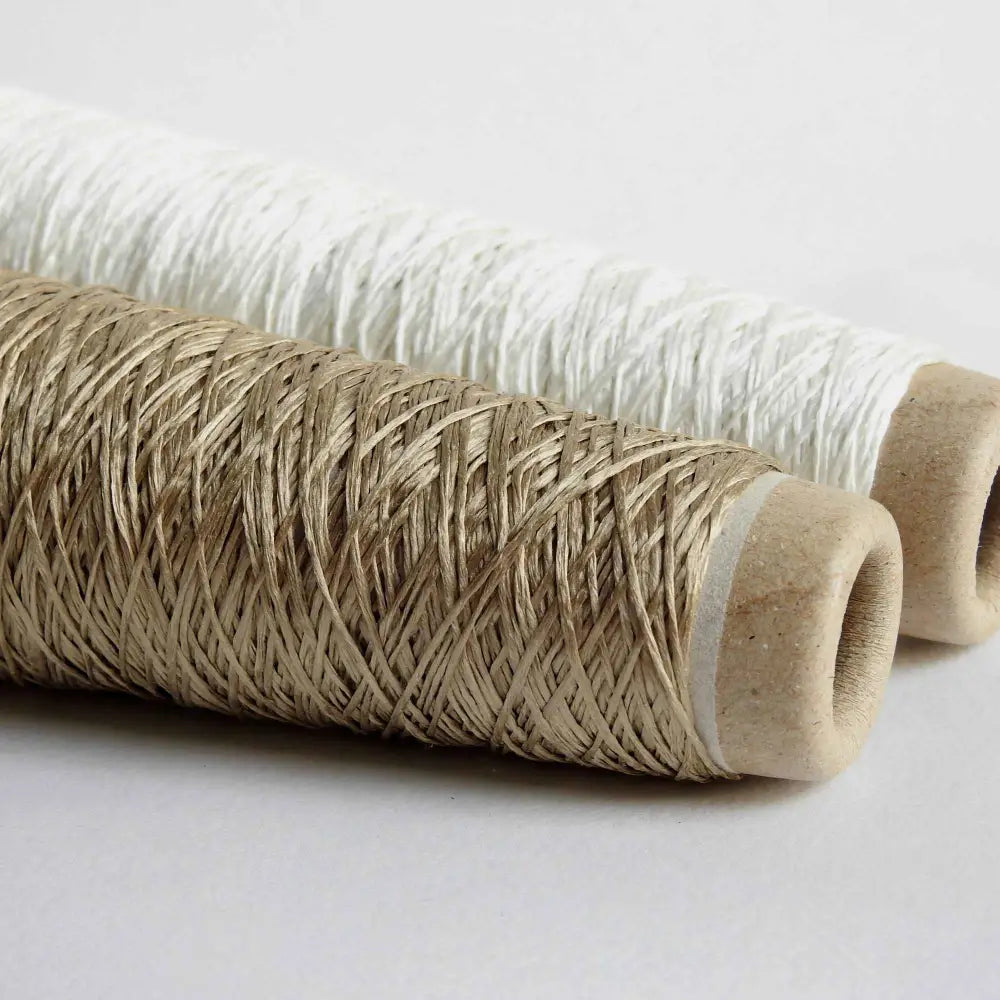 
                  
                    Cones of Habu Textiles Silk Ribbon yarn in Camel and Natural. 100% Raw Silk thread on cone. Pure Silk yarn for knitting crochet weaving jewelry tassels embroidery. Habu Textiles N106
                  
                