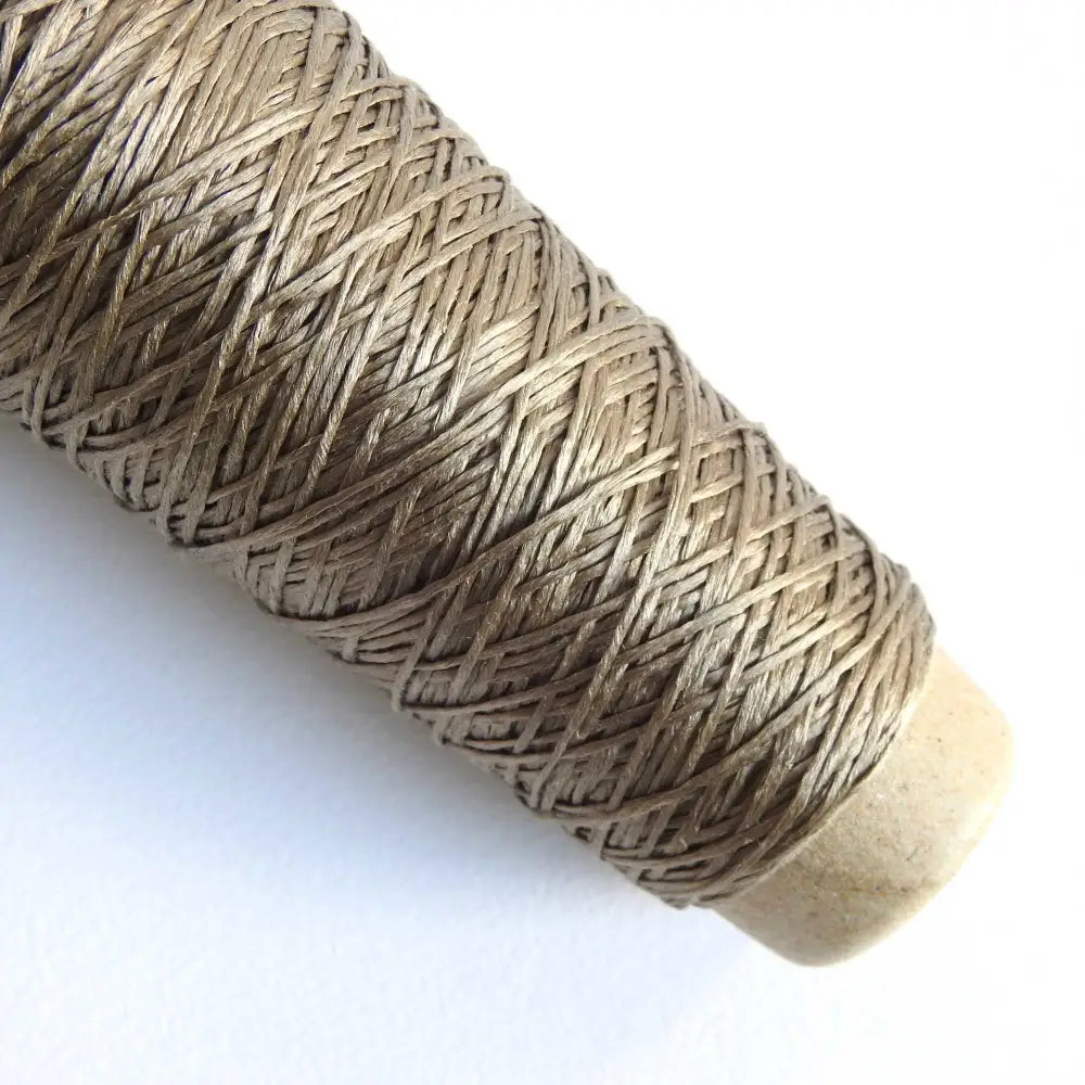 
                  
                    Habu Textiles Silk Ribbon yarn in Khaki. 100% Raw Silk thread on cone. Pure Silk yarn for knitting crochet weaving jewelry tassels embroidery. Habu Textiles N106
                  
                