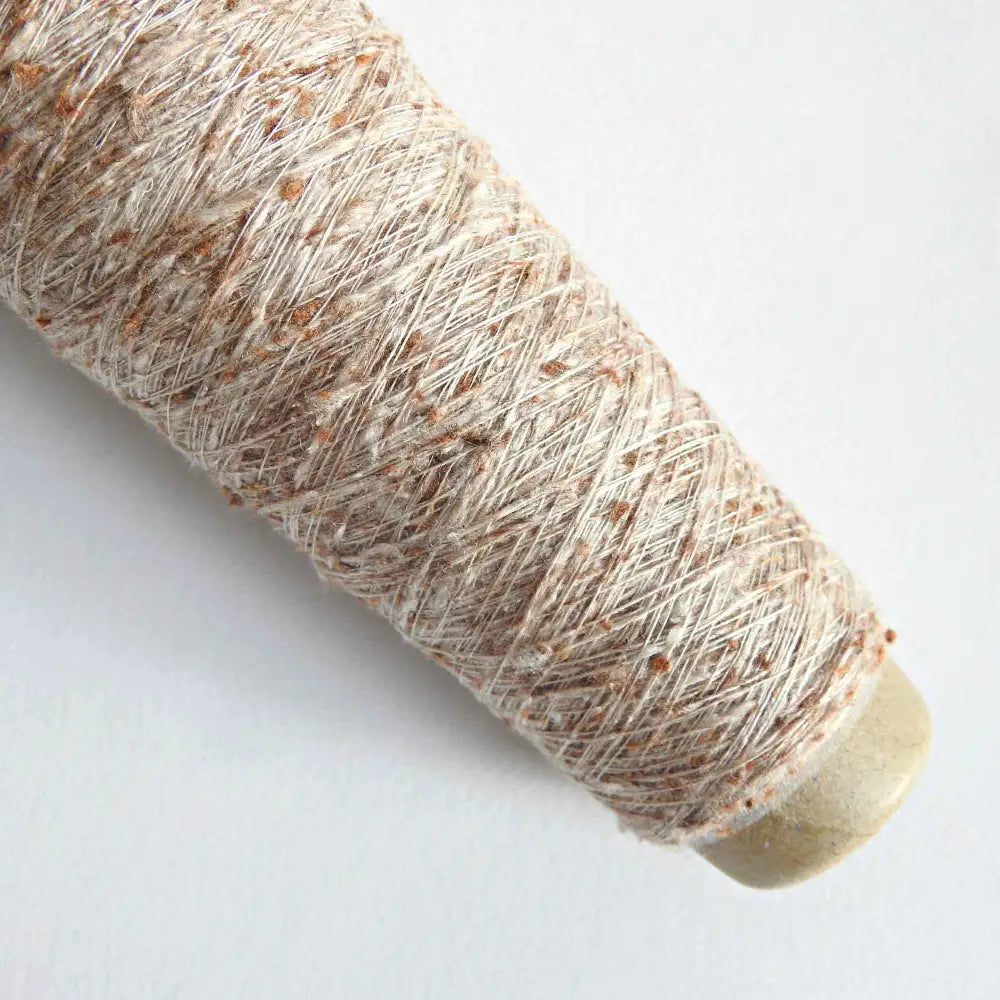 
                  
                    Cone of Habu Textiles Lace Weight Silk Yarn with Fern Cotton. Japanese Silk Yarn for embroidery, weaving, knitting, textiles. Habu Silk Yarn for embroidery, jewelry, shawls. Lace weight knitting yarn. Habu Textiles Fiddlehead Fern Silk Yarn AK-20
                  
                