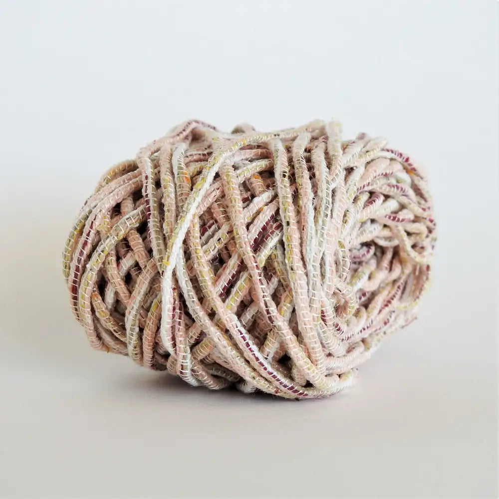 
                  
                    Ball of Habu Wrapped Tsumugi Silk combination in Peach. Soft silk cord made using traditional Japanese techniques. Habu Textiles Silk Wrapped Tsumugi A110
                  
                