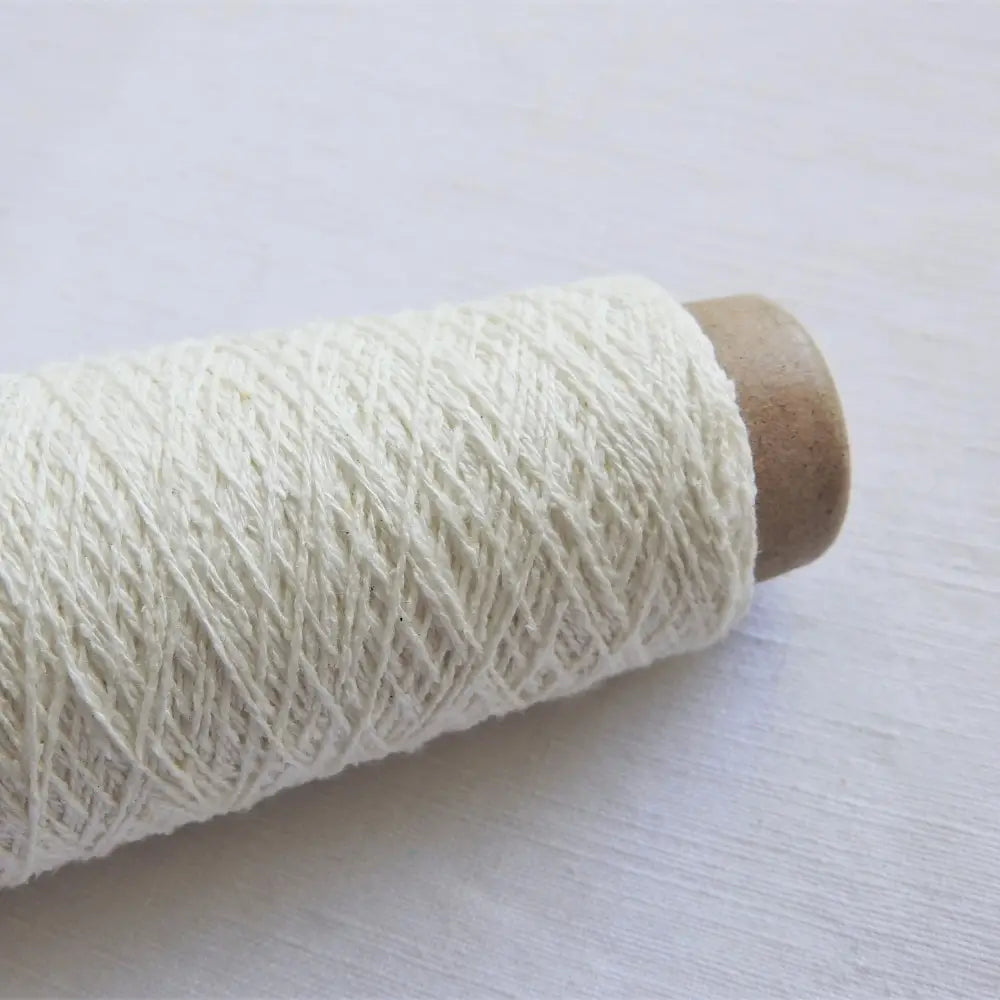 
                  
                    Habu Tsumugi Silk Yarn in White. Japanese Slub Silk on cone for weaving, knitting and crochet. Create beautiful, soft garments, jewelry, bags, scarves, shawls and wraps. Lace yarn with texture. Habu Textiles A-1
                  
                