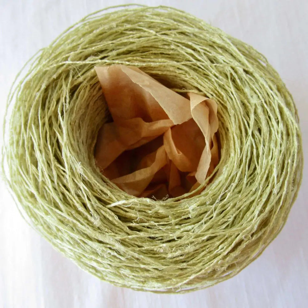 
                  
                    Kibiso Natural Silk Yarn in Green Tea. Japanese Lace yarn in ball for weaving, knitting and crochet. Artisan, specialty yarn with texture to create garments, jewelry, bags, scarves, shawls and wraps with this soft yarn. Knit, crochet and weave. Habu Textiles N-63b
                  
                