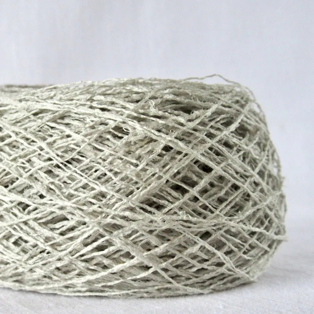 
                  
                    Kibiso Natural Silk Yarn in Light Gray. Japanese Lace yarn in ball for weaving, knitting and crochet. Artisan, specialty yarn with texture to create garments, jewelry, bags, scarves, shawls and wraps with this scuptural yarn. Knit, crochet and weave. Habu Textiles N-63b
                  
                