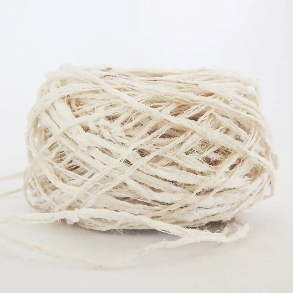 
                  
                    A ball of Habu Textiles Kibiso Silk yarn. 100% raw silk slow crafted chunky yarn for weaving, textile arts. Ball of natural silk yarn. Make beautiful bags, sculptural garments and textile art. Habu Textiles N-63
                  
                