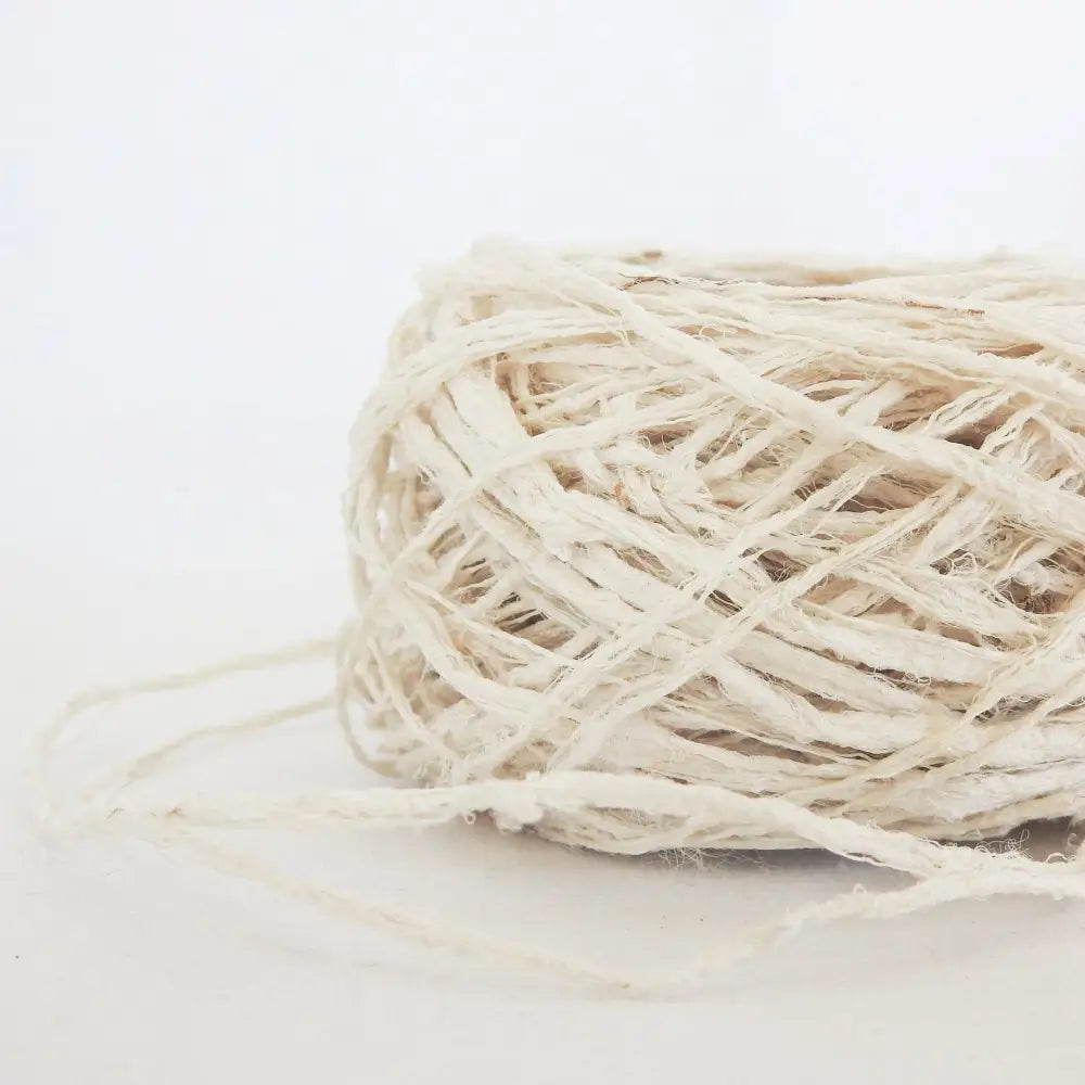 
                  
                    A ball of Habu Textiles Kibiso Silk yarn. 100% raw silk slow crafted chunky yarn for weaving, textile arts. Ball of natural silk yarn. Make beautiful bags, sculptural garments and textile art. Habu Textiles N-63
                  
                