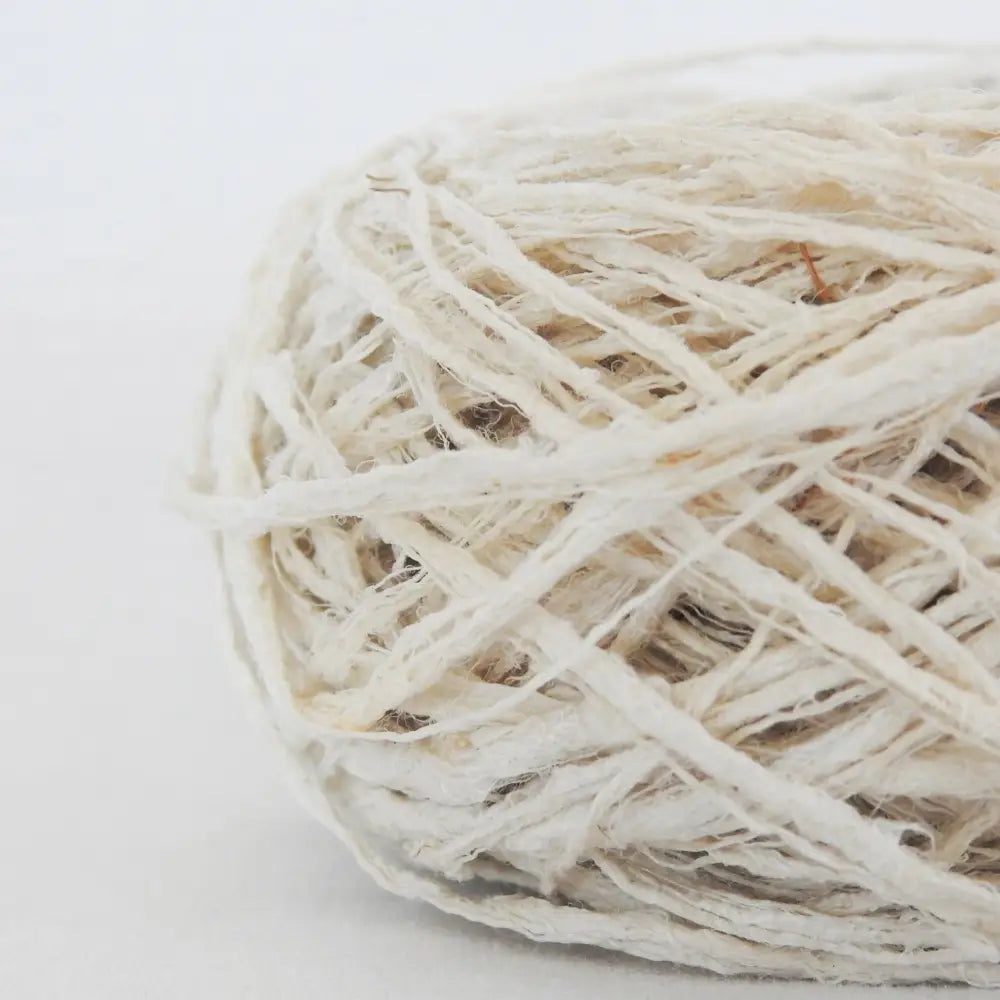 
                  
                    A ball of Habu Textiles Kibiso Silk yarn. 100% raw silk slow crafted chunky yarn for weaving, textile arts. Ball of natural silk yarn. Make beautiful bags, sculptural garments and textile art. Habu Textiles N-63
                  
                