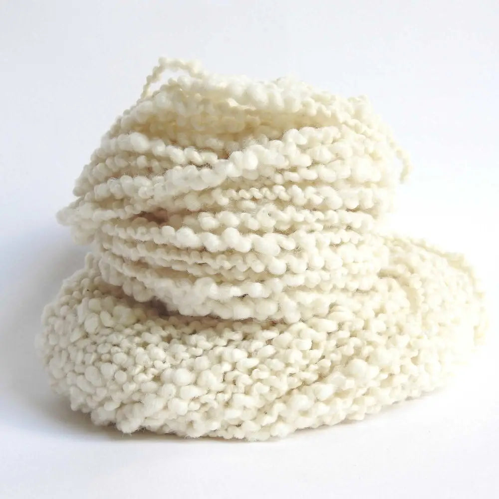 A skein of Pascuali Nube yarn. A chunky wool yarn. Baby soft boucle yarn for scarf, jumper, blanket, baby, hat. A Mulesing-free wool grown and harvested sustainably.