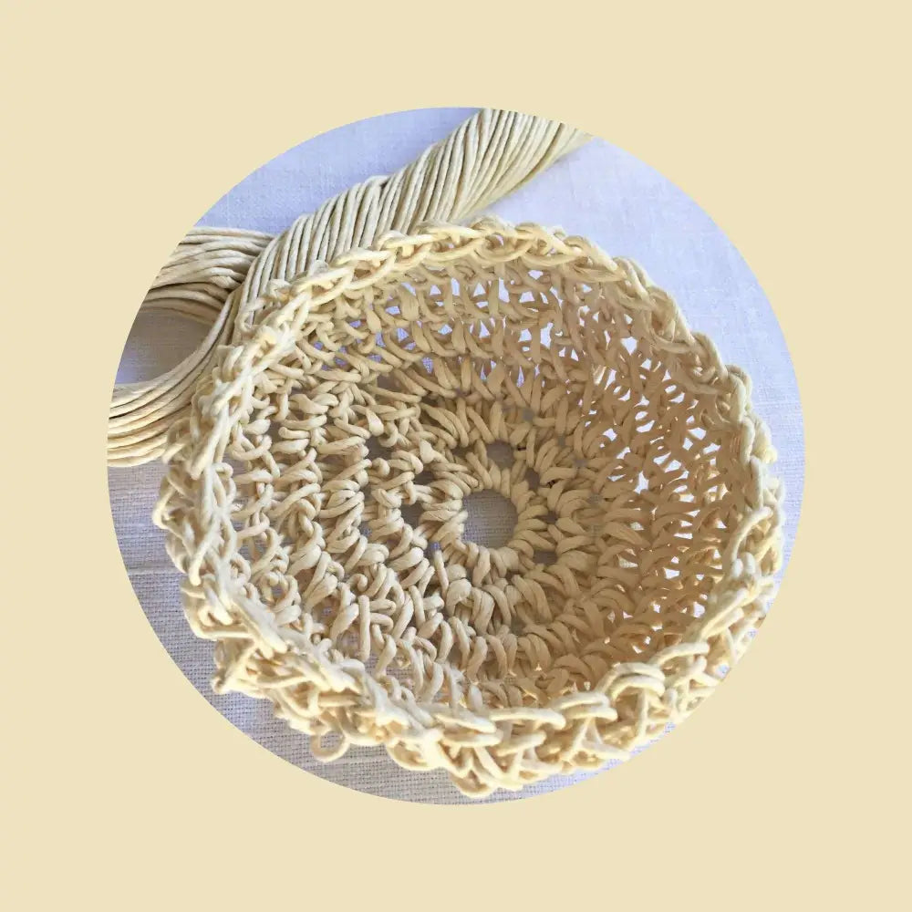 
                  
                    Crochet basket using Paper String in Cream. Natural strong twisted paper twine. Twine art.
                  
                