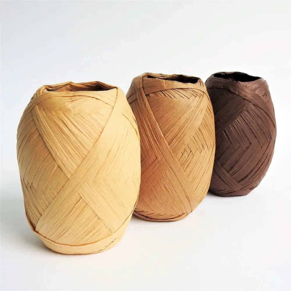 Balls of Raffia yarn for weaving, crochet and crafting in Natural, Brown and Dark Brown. Natural soft raffia for baskets, hats, bags and mats. Vegan, eco friendly coloured raffia ribbon.