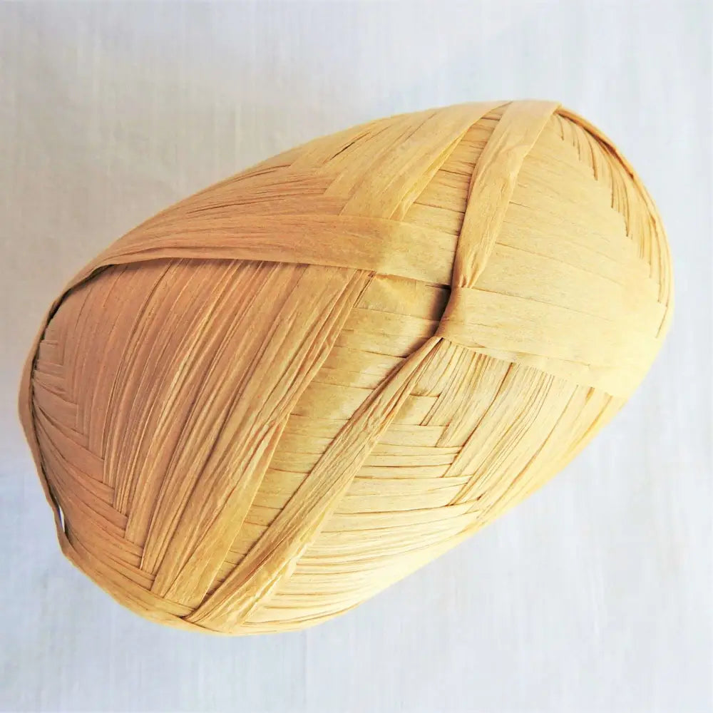 
                  
                    Ball of Raffia yarn for weaving, crochet and crafting in Natural. Natural soft raffia for baskets, hats, bags and mats. Vegan, eco friendly coloured raffia ribbon.
                  
                