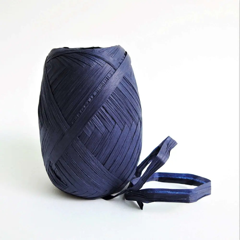 
                  
                    Ball of Raffia yarn for weaving, crochet and crafting in Navy. Natural soft raffia for baskets, hats, bags and mats. Vegan, eco friendly coloured raffia ribbon.
                  
                