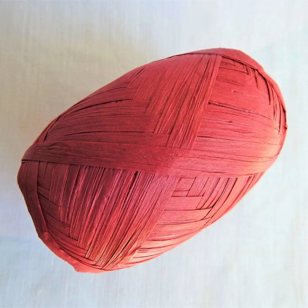
                  
                    Ball of Raffia yarn for weaving, crochet and crafting in Red. Natural soft raffia for baskets, hats, bags and mats. Vegan, eco friendly coloured raffia ribbon.
                  
                