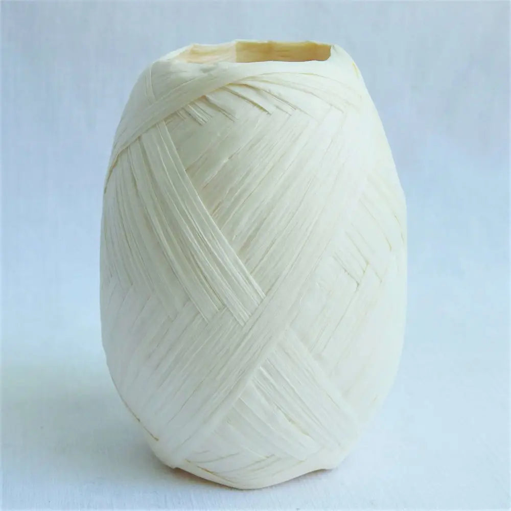 
                  
                    Ball of Raffia yarn for weaving, crochet and crafting in White. Natural soft raffia for baskets, hats, bags and mats. Vegan, eco friendly coloured raffia ribbon.
                  
                