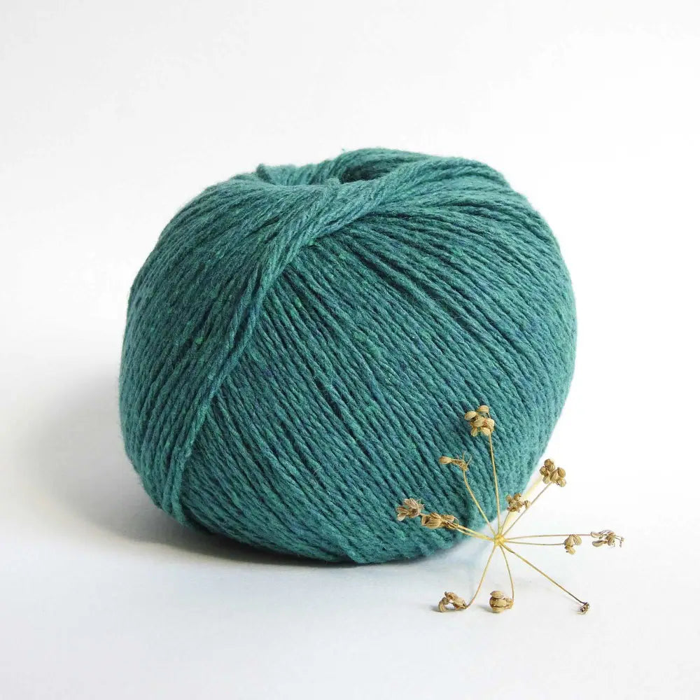 
                  
                    Ball of Chunky Cotton Yarn crafted from recycled denim jeans in colour Petrol Green. Recycled yarn for sweater, scarf, beanie, hat. Natural cotton yarn. Eco Friendly vegan yarn. Pascuali Re-Jeans.
                  
                