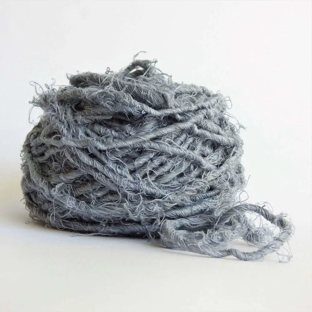 
                  
                    Ball of chunky yarn in Dark Grey. A thick yarn hand crafted from recycled linen material. A recycled yarn for blankets, macrame, scarves, hats, bags. Sustainable eco friendly vegan yarn. Sustainable yarn australia.
                  
                