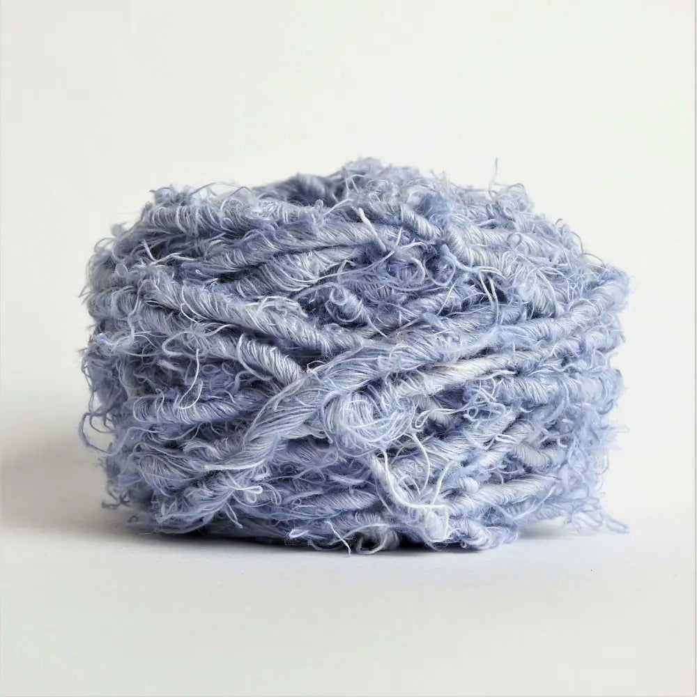 
                  
                    Ball of chunky yarn in Denim. A thick yarn hand crafted from recycled linen material. A recycled yarn for blankets, macrame, scarves, hats, bags. Sustainable eco friendly vegan yarn. Sustainable yarn australia.
                  
                
