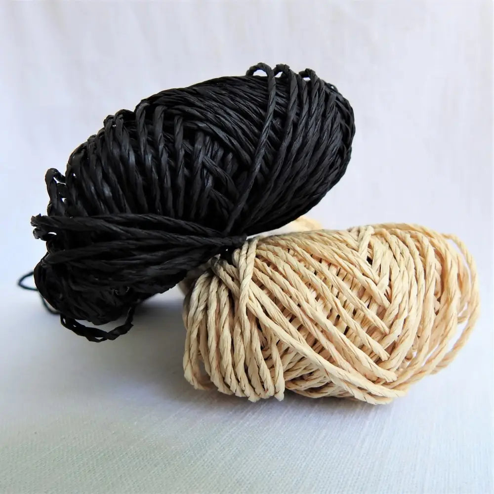 
                  
                    Skeins of Sasawashi Bamboo Paper yarn in black and natural. Daruma Bamboo yarn for summer hats, bags, baskets. Eco friendly, vegan yarn for weaving, knitting, crochet, craft. Daruma Ito Yokota Sasawashi.
                  
                