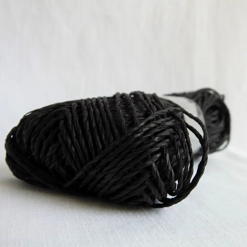 
                  
                    Skein of Sasawashi Bamboo Paper yarn in #18 black. Daruma Bamboo yarn for summer hats, bags, baskets. Eco friendly, vegan yarn for weaving, knitting, crochet, craft. Daruma Ito Yokota Sasawashi.
                  
                