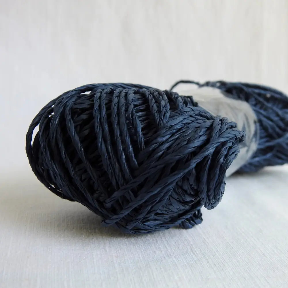 
                  
                    Skein of Sasawashi Bamboo Paper yarn in #11 navy. Daruma Bamboo yarn for summer hats, bags, baskets. Eco friendly, vegan yarn for weaving, knitting, crochet, craft. Daruma Ito Yokota Sasawashi.
                  
                