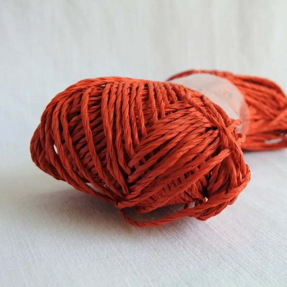 
                  
                    Skein of Sasawashi Bamboo Paper yarn in #10 orange. Daruma Bamboo yarn for summer hats, bags, baskets. Eco friendly, vegan yarn for weaving, knitting, crochet, craft. Daruma Ito Yokota Sasawashi.
                  
                