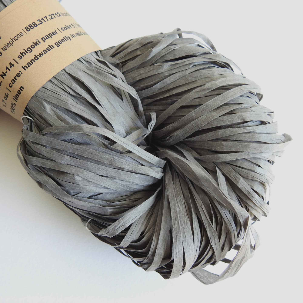 
                  
                    Skein of Habu Textiles Linen Paper yarn in Indigo. Linen Paper tape yarn is light, durable and strong and creates beautiful fabrics which are comfortable to wear.  Japanese paper yarn for weaving, crochet, knitting, textile arts, jewellery. Habu Textiles Linen Paper "Shigoki" yarn N-14
                  
                