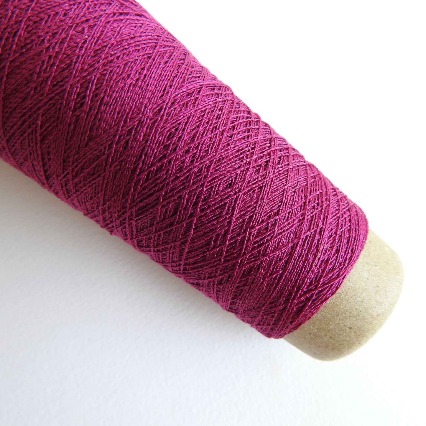 
                  
                    A cone of Silk Stainless Steel lace weight yarn in Fuschia for knitting crochet and weaving. Make beautiful scarves, garments and jewelry. The yarn has a stainless steel core with fine silk wrapped around it. They cone of yarn has a very elegant sheen and is beautiful to look at. Habu Textiles A20
                  
                