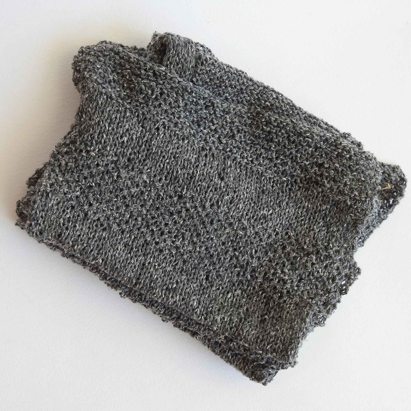 
                  
                    Habu Tsumugi Silk Yarn in #2 Medium Gray - knitted sample. Japanese Slub Silk on cone for weaving, knitting and crochet. Create beautiful, soft garments, jewelry, bags, scarves, shawls and wraps. Lace yarn with texture. Habu Textiles A-1
                  
                