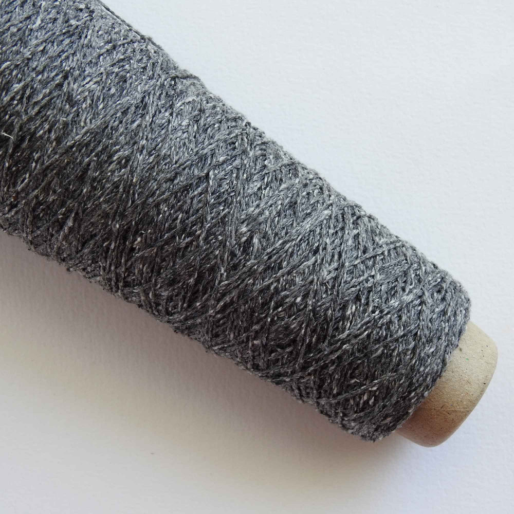 
                  
                    Habu Tsumugi Silk Yarn in #2 Medium Gray. Japanese Slub Silk on cone for weaving, knitting and crochet. Create beautiful, soft garments, jewelry, bags, scarves, shawls and wraps. Lace yarn with texture. Habu Textiles A-1
                  
                
