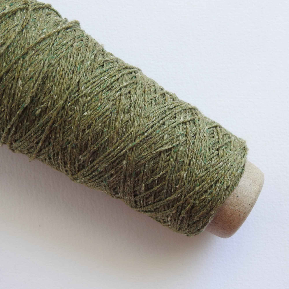 
                  
                    Habu Tsumugi Silk Yarn in #40 Green. Japanese Slub Silk on cone for weaving, knitting and crochet. Create beautiful, soft garments, jewelry, bags, scarves, shawls and wraps. Lace yarn with texture. Habu Textiles A-1
                  
                
