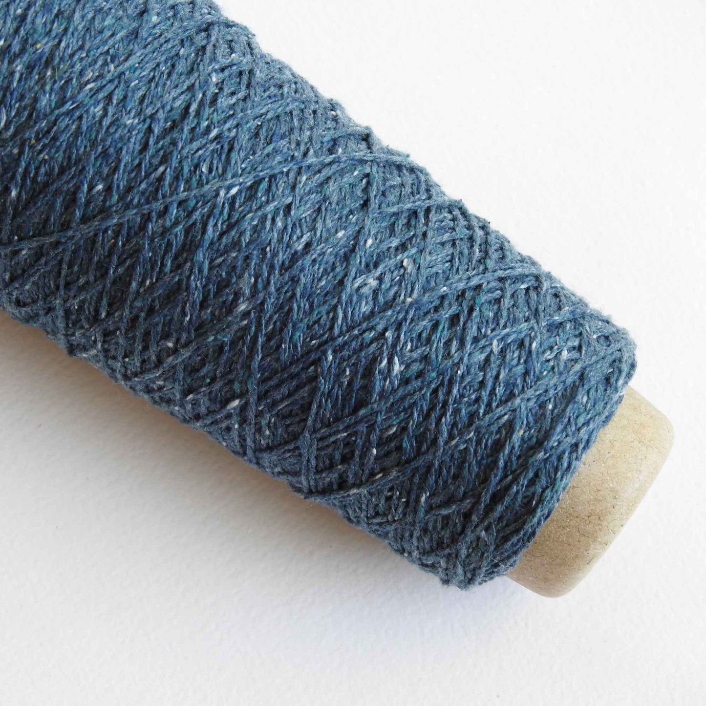 
                  
                    Habu Tsumugi Silk Yarn in #47 Dark Blue. Japanese Slub Silk on cone for weaving, knitting and crochet. Create beautiful, soft garments, jewelry, bags, scarves, shawls and wraps. Lace yarn with texture. Habu Textiles A-1
                  
                