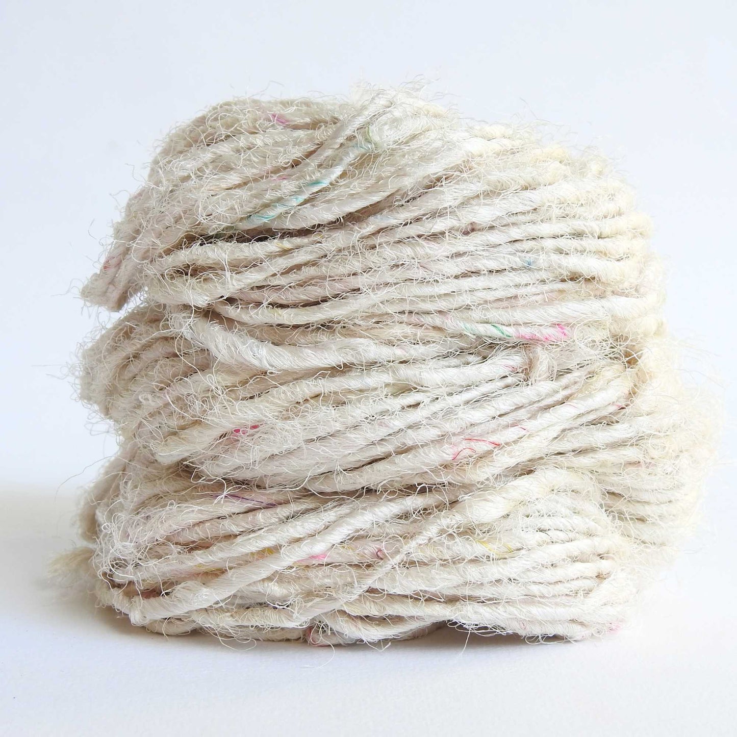 
                  
                    Ball of Sari Silk Yarn in Snow. Recycled sari silk yarn Australia. Eco friendly yarn. Handspun, chunky yarn for knitting, crochet, weaving, craft.
                  
                