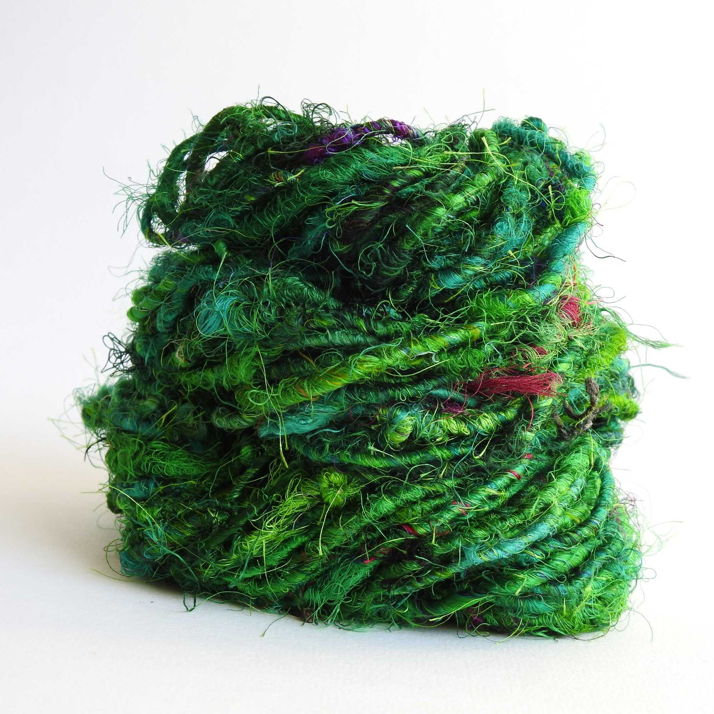 
                  
                    Ball of Sari Silk Yarn in Emerald. Recycled sari silk yarn Australia. Eco friendly yarn. Handspun, chunky yarn for knitting, crochet, weaving, craft.
                  
                