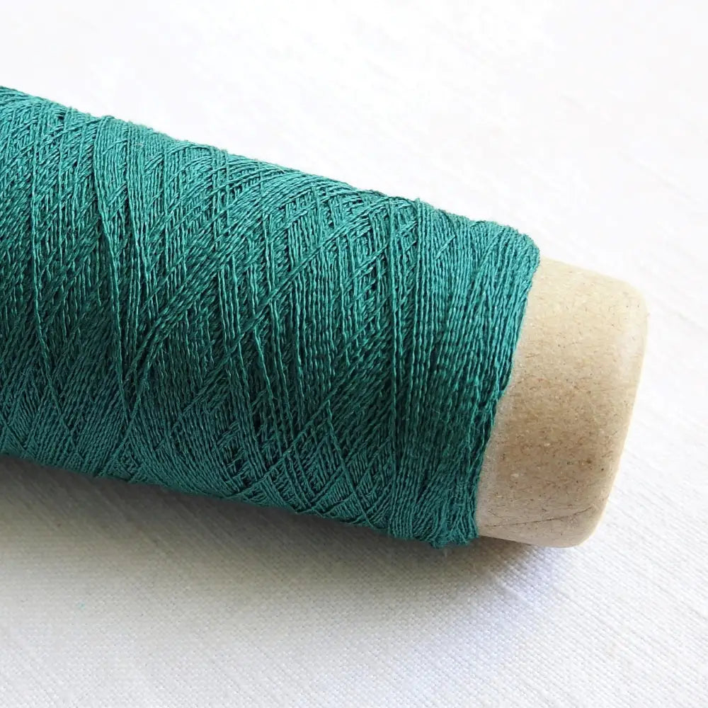 
                  
                    A cone of Silk Stainless Steel lace weight yarn in Ocean Blue for knitting crochet and weaving. Make beautiful scarves, garments and jewelry. The yarn has a stainless steel core with fine silk wrapped around it. They cone of yarn has a very elegant sheen and is beautiful to look at. Habu Textiles A20
                  
                