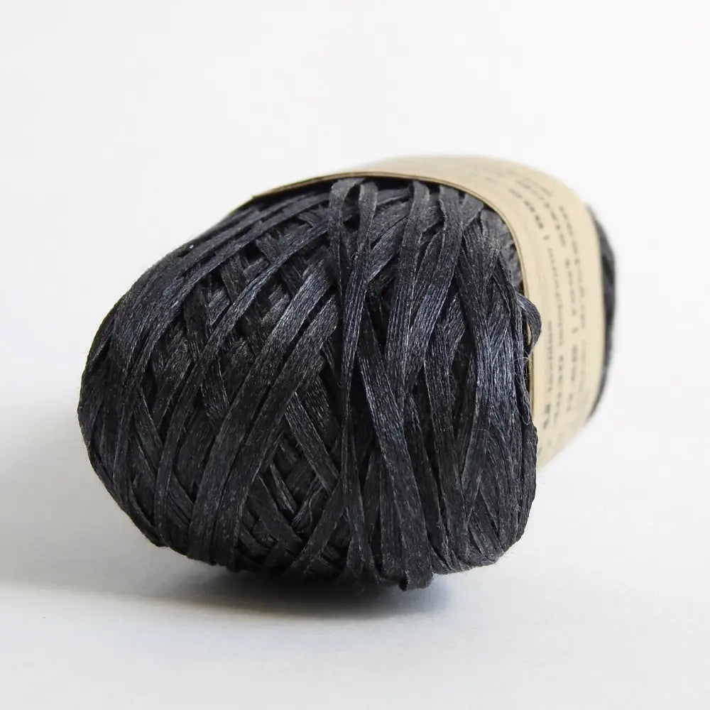 
                  
                    Ball of Habu Silk Tape Yarn in Charcoal. 100% Japanese silk yarn for knitting, crochet, weaving. Make hats, bags, garments, shawls. Silky and luminous fine tape. Habu Textiles N-6B
                  
                
