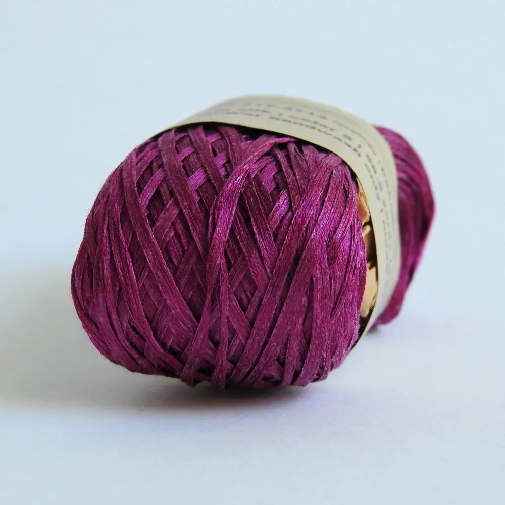 
                  
                    Ball of Habu Silk Tape Yarn in Fuschia. 100% Japanese silk yarn for knitting, crochet, weaving. Make hats, bags, garments, shawls. Silky and luminous fine tape. Habu Textiles N-6B
                  
                