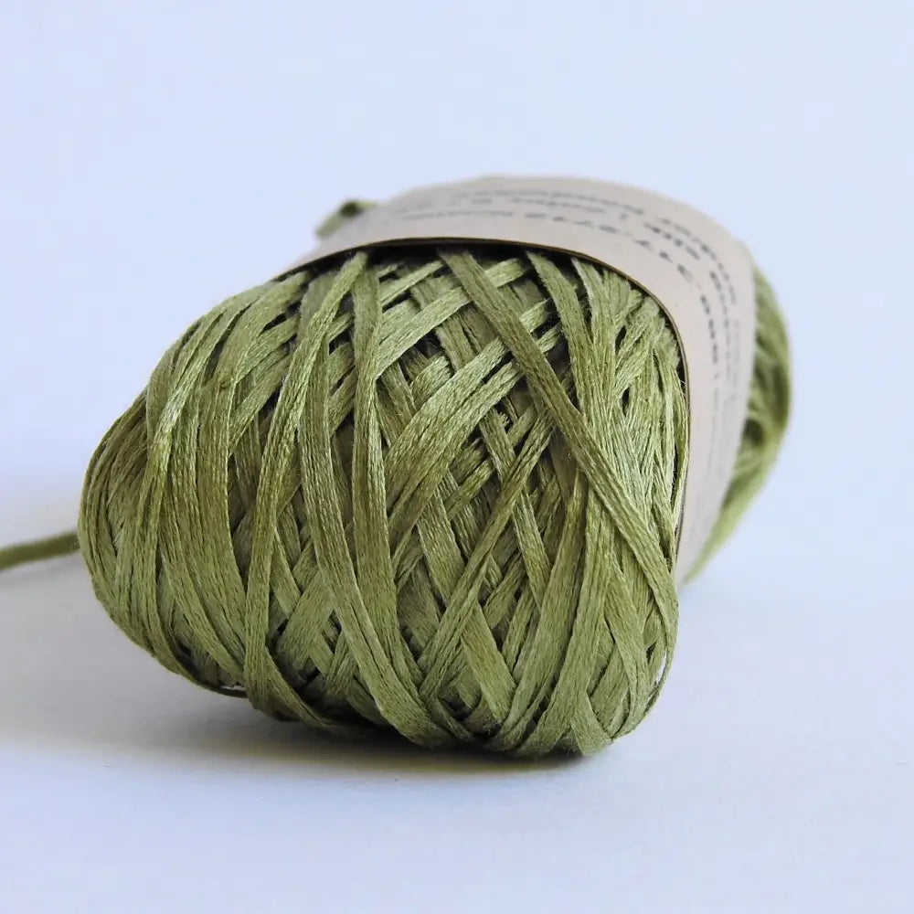 
                  
                    Ball of Habu Silk Tape Yarn in Grass. 100% Japanese silk yarn for knitting, crochet, weaving. Make hats, bags, garments, shawls. Silky and luminous fine tape. Habu Textiles N-6B
                  
                