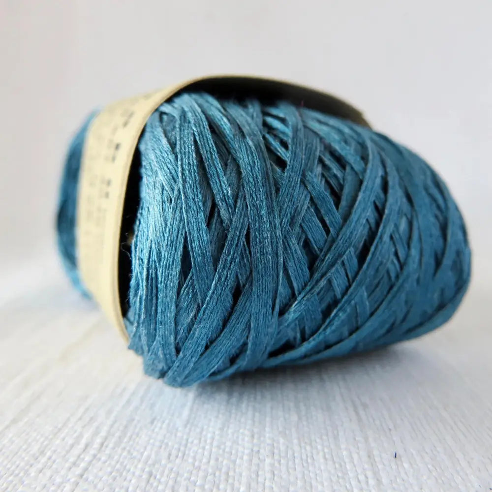 
                  
                    Japanese Silk Tape Yarn in Indigo. Ball of 100% silk for knitting, crochet, weaving. Make hats, bags, garments, shawls. Silky and luminous fine tape. Habu Textiles N-6B
                  
                